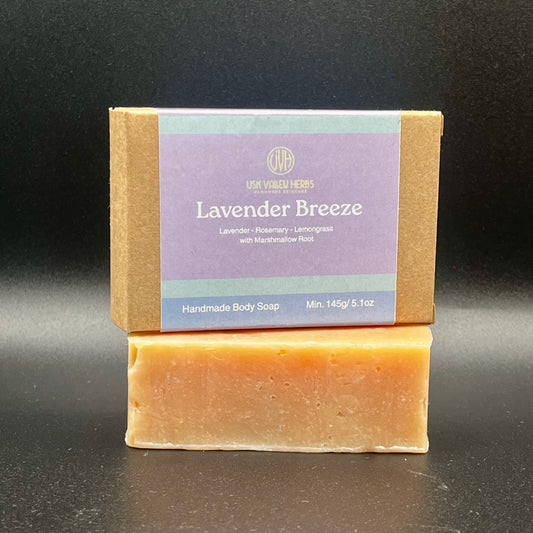A bar of handmade natural soap called Lavender Breeze. Made with essential oils of Lavender, Rosemary and Lemongrass. Palm oil free, no fake scents, no SLS or parabens